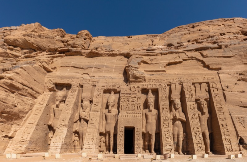 Abu Simbel temple facade with four colossal statues of Ramesses II